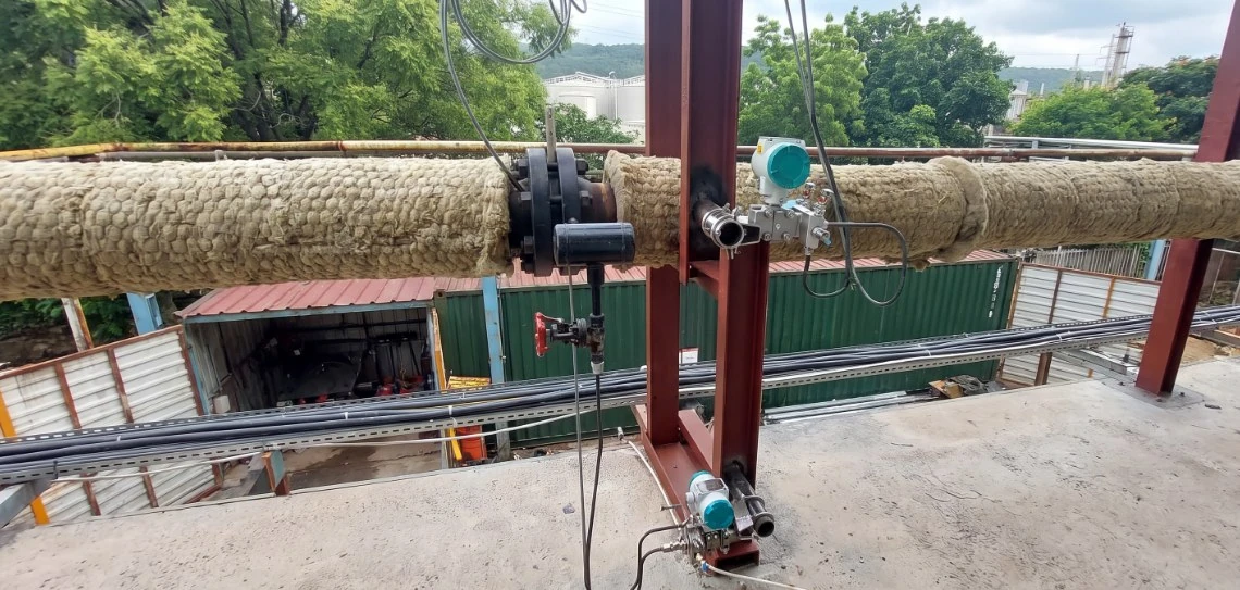 Insulated utility line with orifice tappings, manifolds and differential pressure transmitters